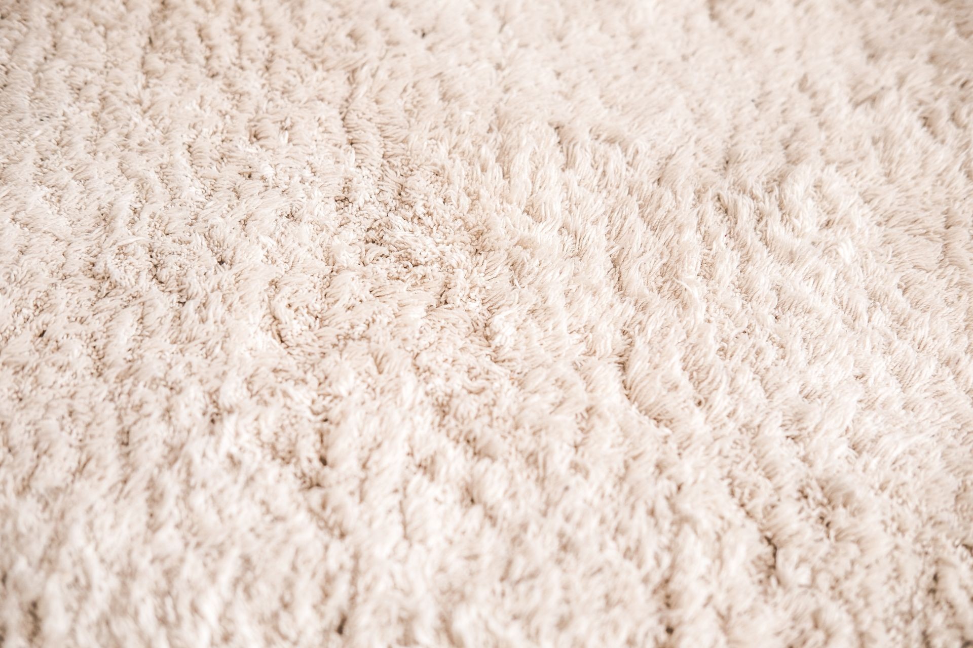 Soft cozy beige carpet. Close up